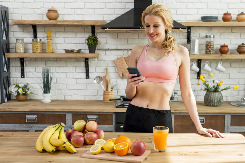 blond woman kitchen with fruits