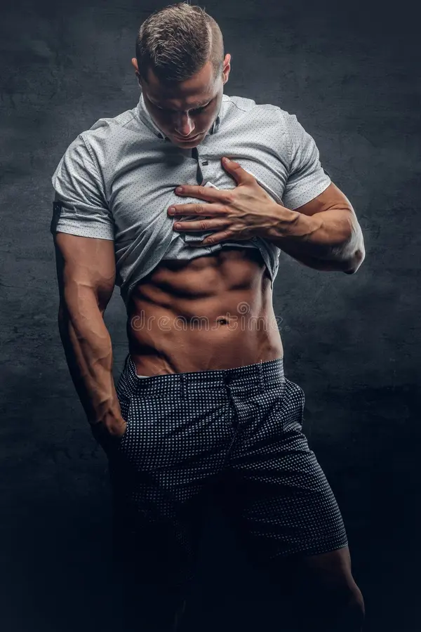 young athletic male white shirt shows six pack abs young athletic male shows six pack abs 114877040