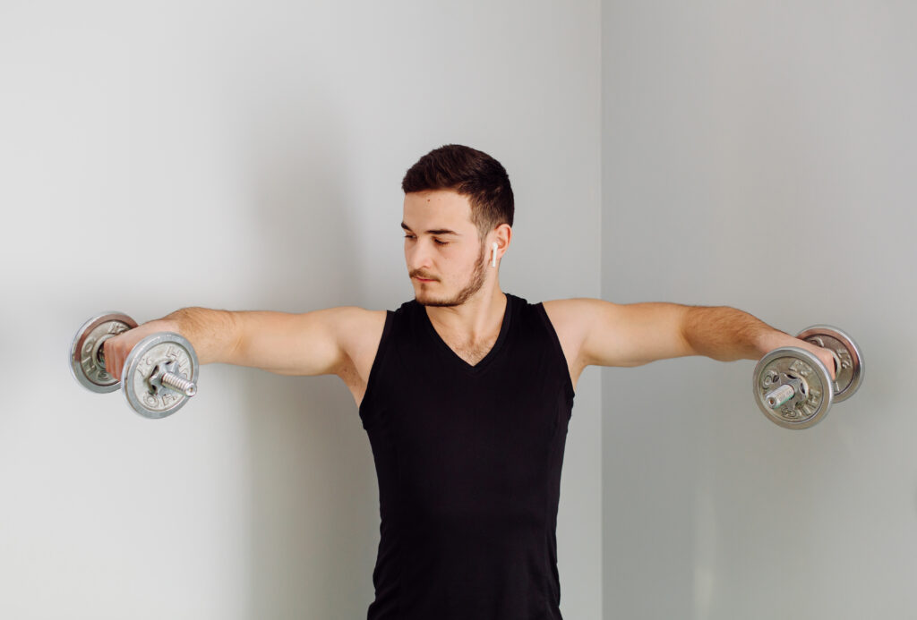 Young Man Making Sport Exercises Home 1024x693